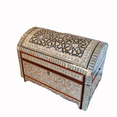 Decorative wooden box with intricate patterns on a white background