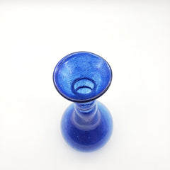 Blue glass object on a white background