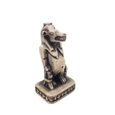 Statue of an Egyptian hippo goddess on a white background