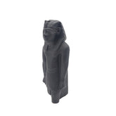 Black stone statue of Ramses on a white background