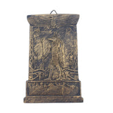 Decorative wall art with Egyptian-themed design on a white background