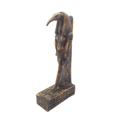 Decorative statue of a bird-like figure on a white background