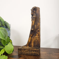 Decorative King Amunhotep Statue with intricate carvings on a white background