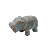 Bronze hippo figurine on a white background