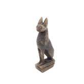 Bronze statue of a cat on a white background