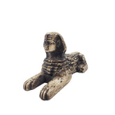 Bronze sphinx figurine on a white background