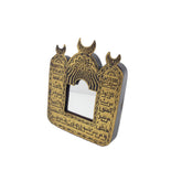 Decorative mirror with Arabic text and patterns on a white background
