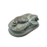 Decorative Egyptian scarab statue with a rustic finish on a white background