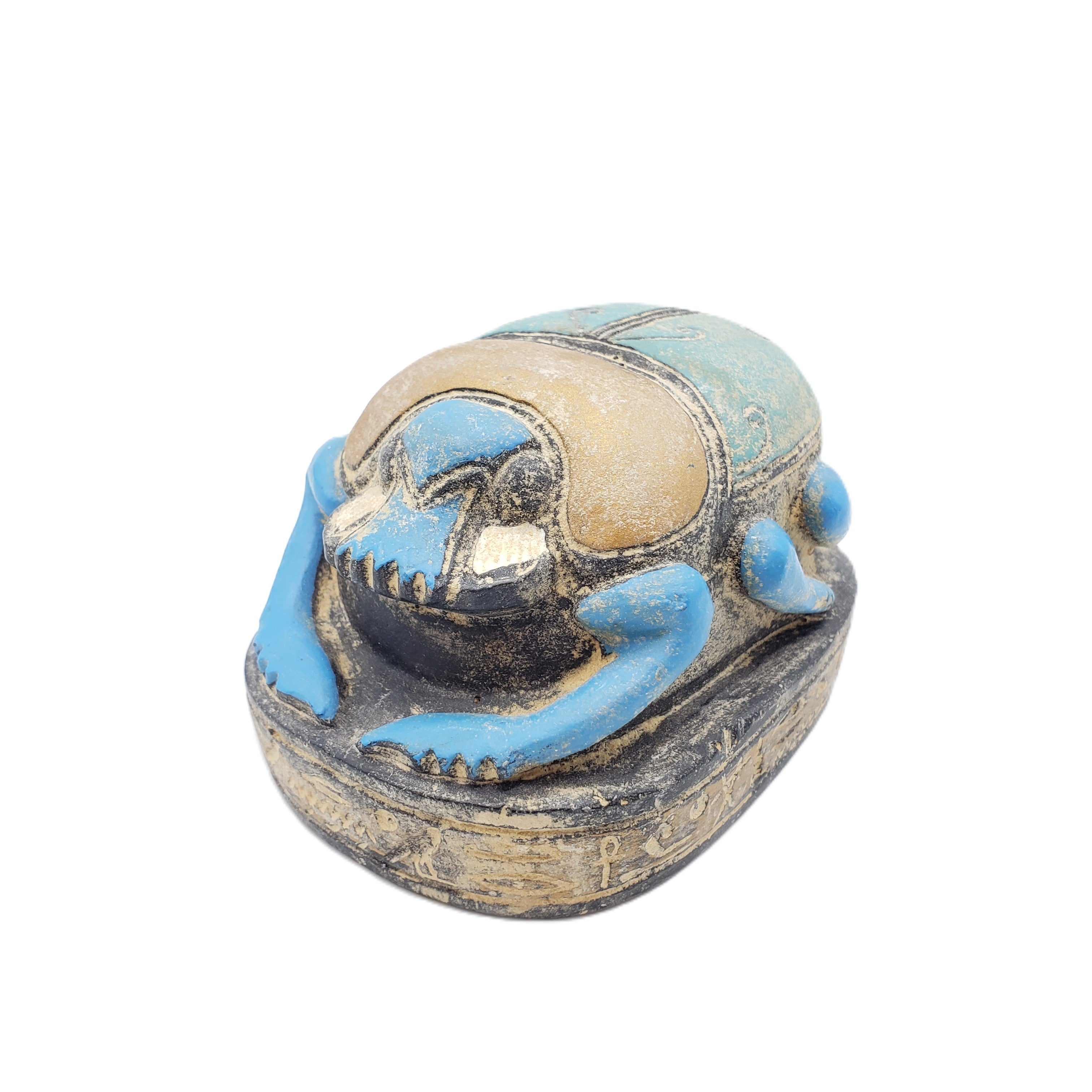 Decorative figurine of a Egyptian scarab statue on a white background