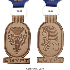 Front and back views of a Egypt-themed keychain, showing engraved scarab beetle and pharaoh designs, on a white background.