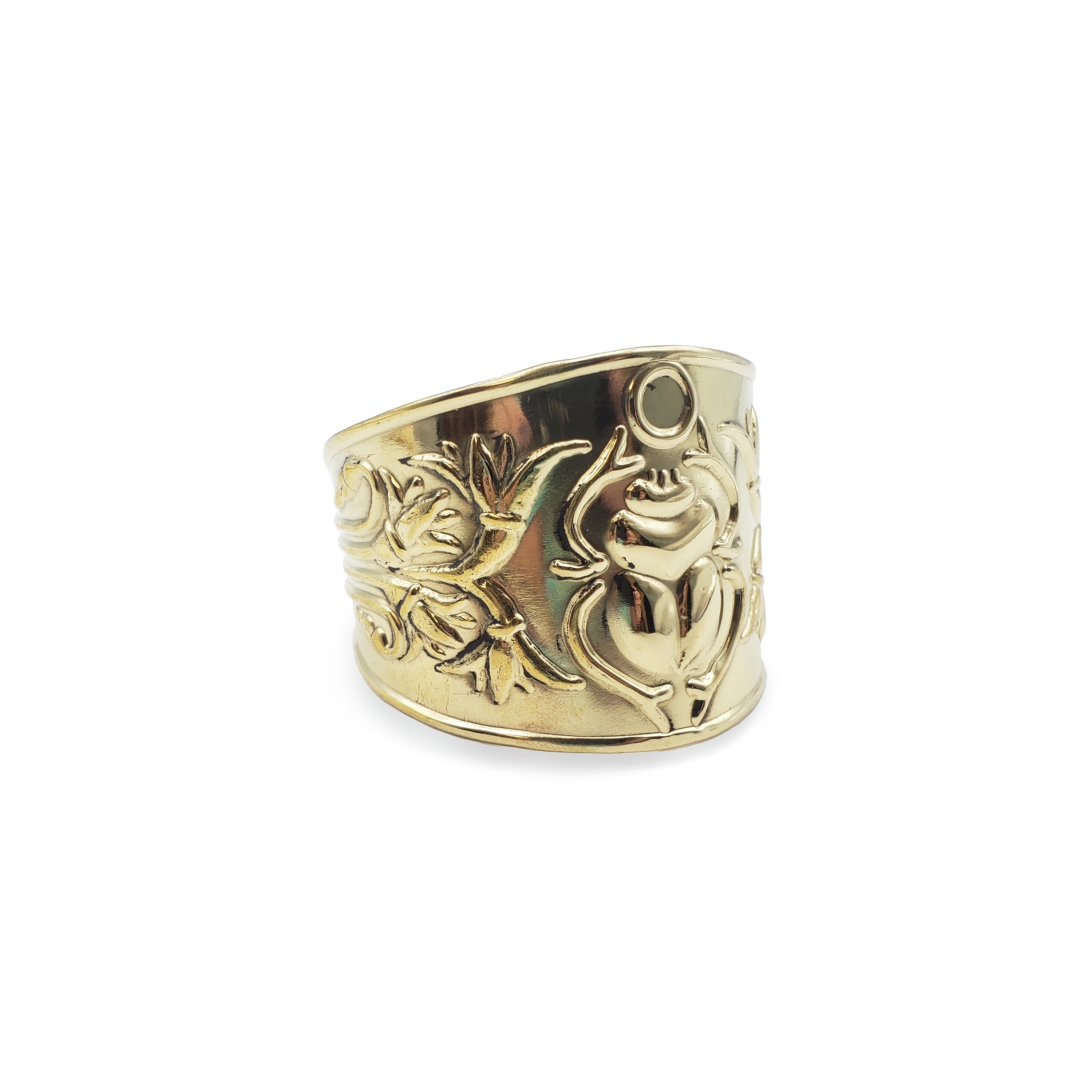 Gold ring with floral design on a white background