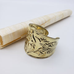 Gold decorative object on a white background