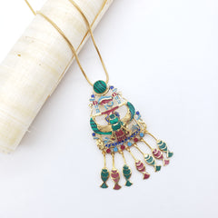 Decorative headpiece with colorful gemstones on a white background