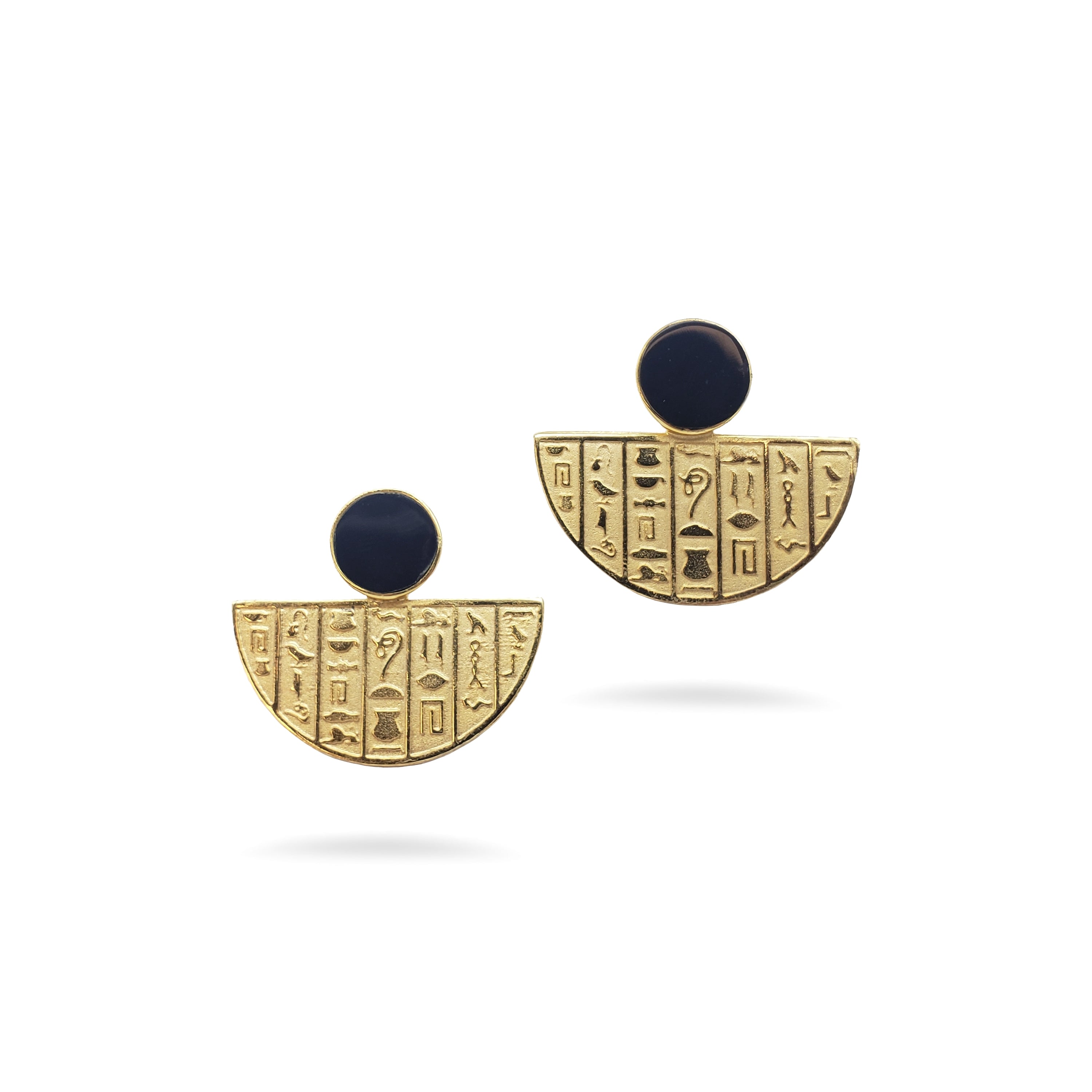 Pair of gold earrings with black stones on a white background