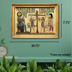Framed artwork of Egyptian hieroglyphs on a green wall with plants and light bulbs.