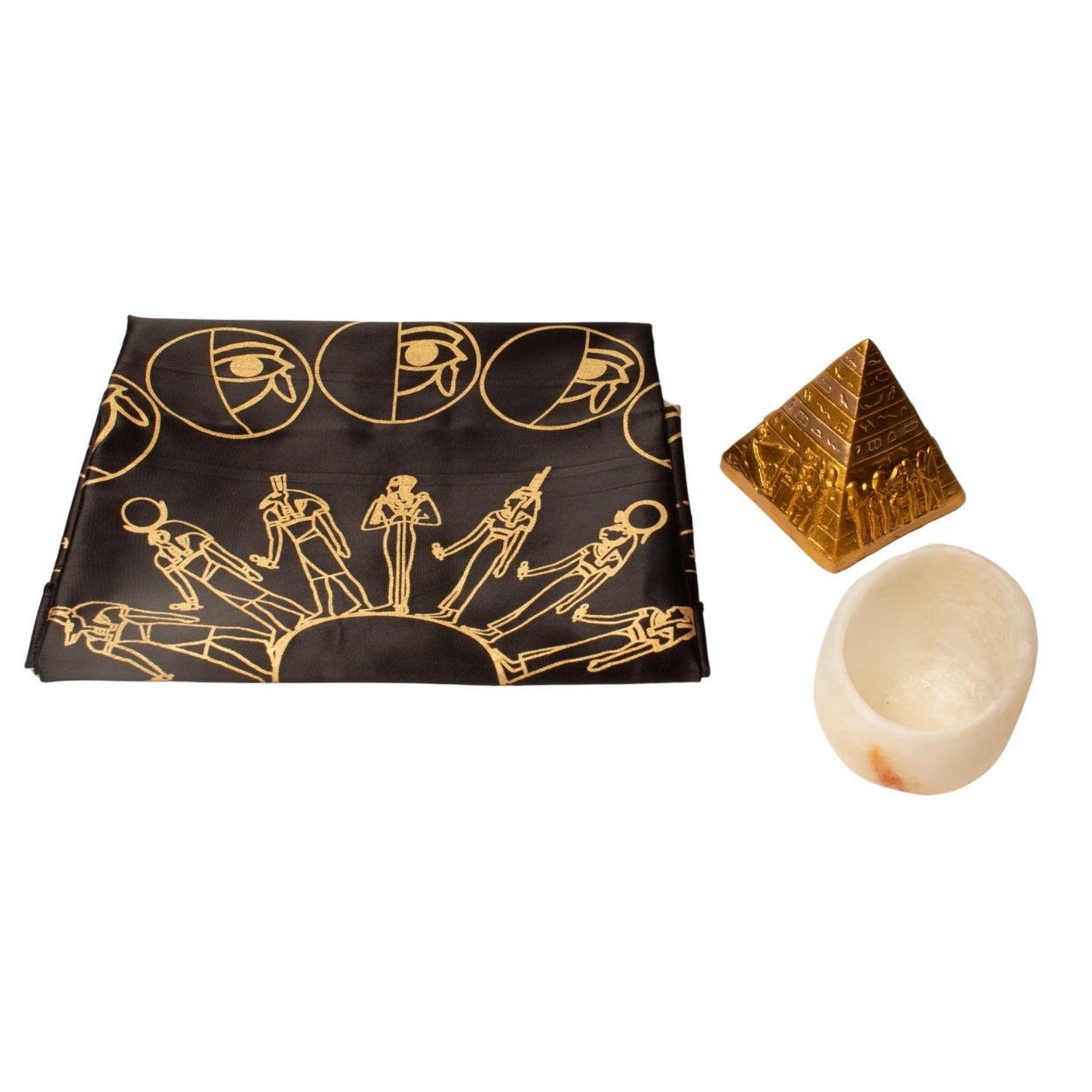 Decorative cloth with Egyptian-themed design, pyramid-shaped object, and stone on a white background