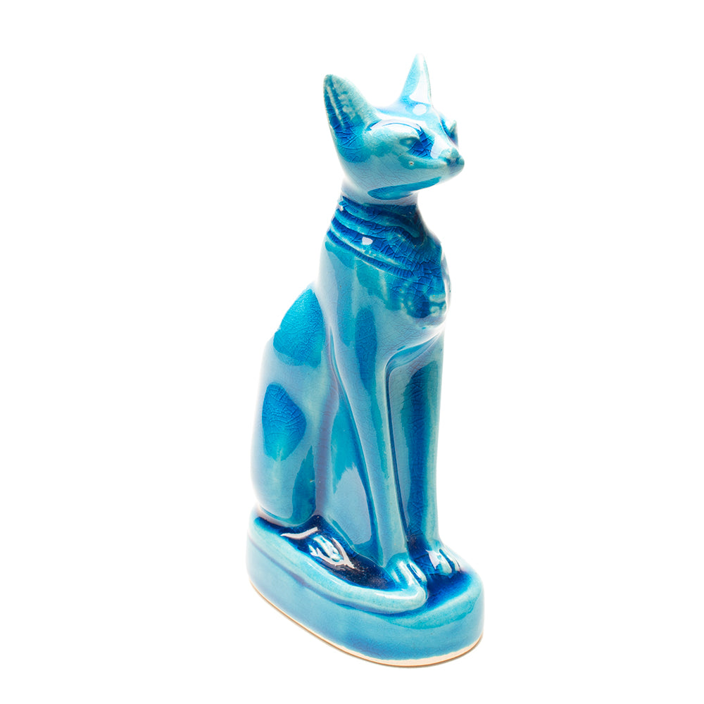 Blue ceramic cat figurine on a white background