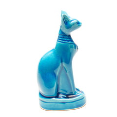 Blue ceramic cat figurine on a white background