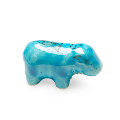 Blue ceramic hippo figurine on a white background