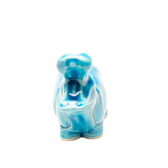 Blue ceramic hippo figurine on a white background