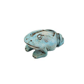 Blue ceramic frog-shaped statue on a white background