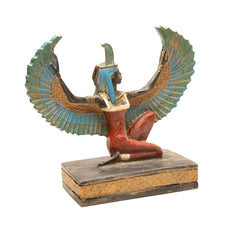 Statue of a winged figure with detailed design on a white background