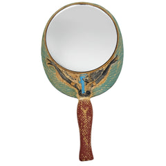 Decorative hand mirror with a handle on a white background