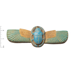 Decorative item with a blue scarab and wings on a white background