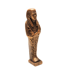 Bronze-colored Egyptian-style statuette on a white background
