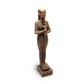 Bronze statue of an Egyptian figure on a white background
