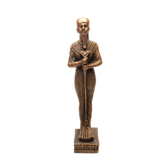 Bronze statue of an Egyptian pharaoh on a white background