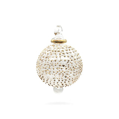 Decorative ornament with gold embellishments on a white background