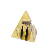 Pyramid-shaped object with a figure of a woman on a white background