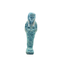 Blue Egyptian-style figurine on a white background