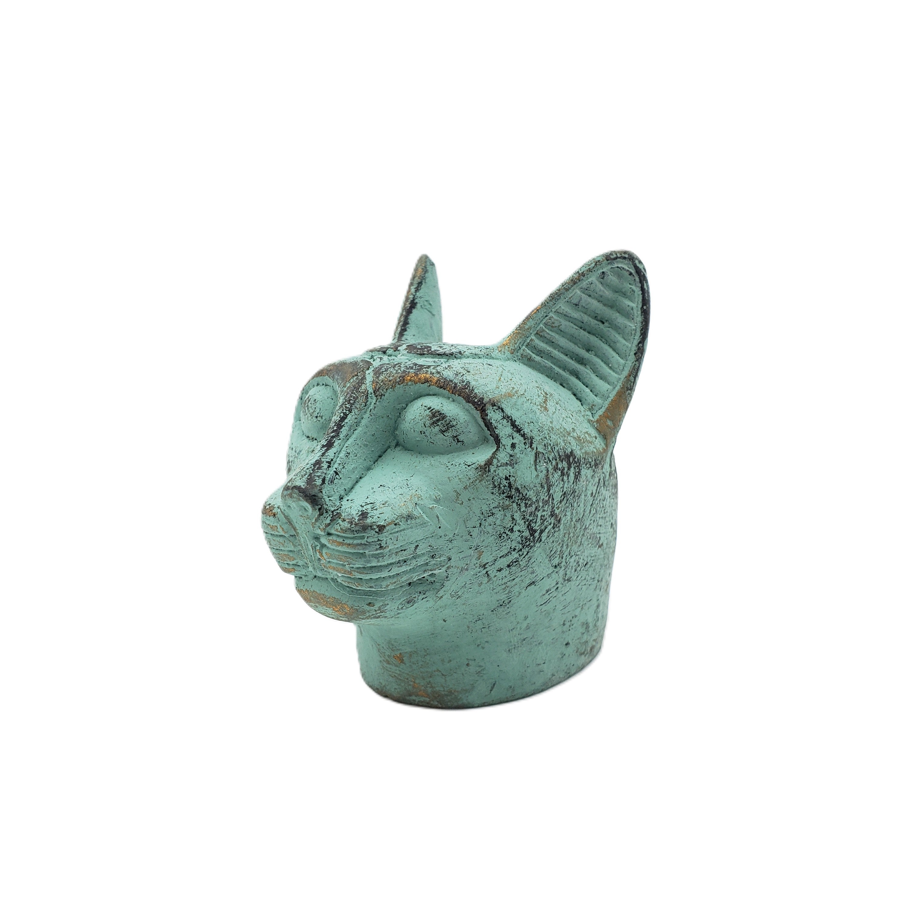 Turquoise cat-shaped statue on a white background