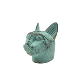 Turquoise cat-shaped statue on a white background