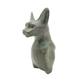 Patina statue of a cat with a on a white background