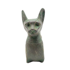 Patina statue of a cat with a white background