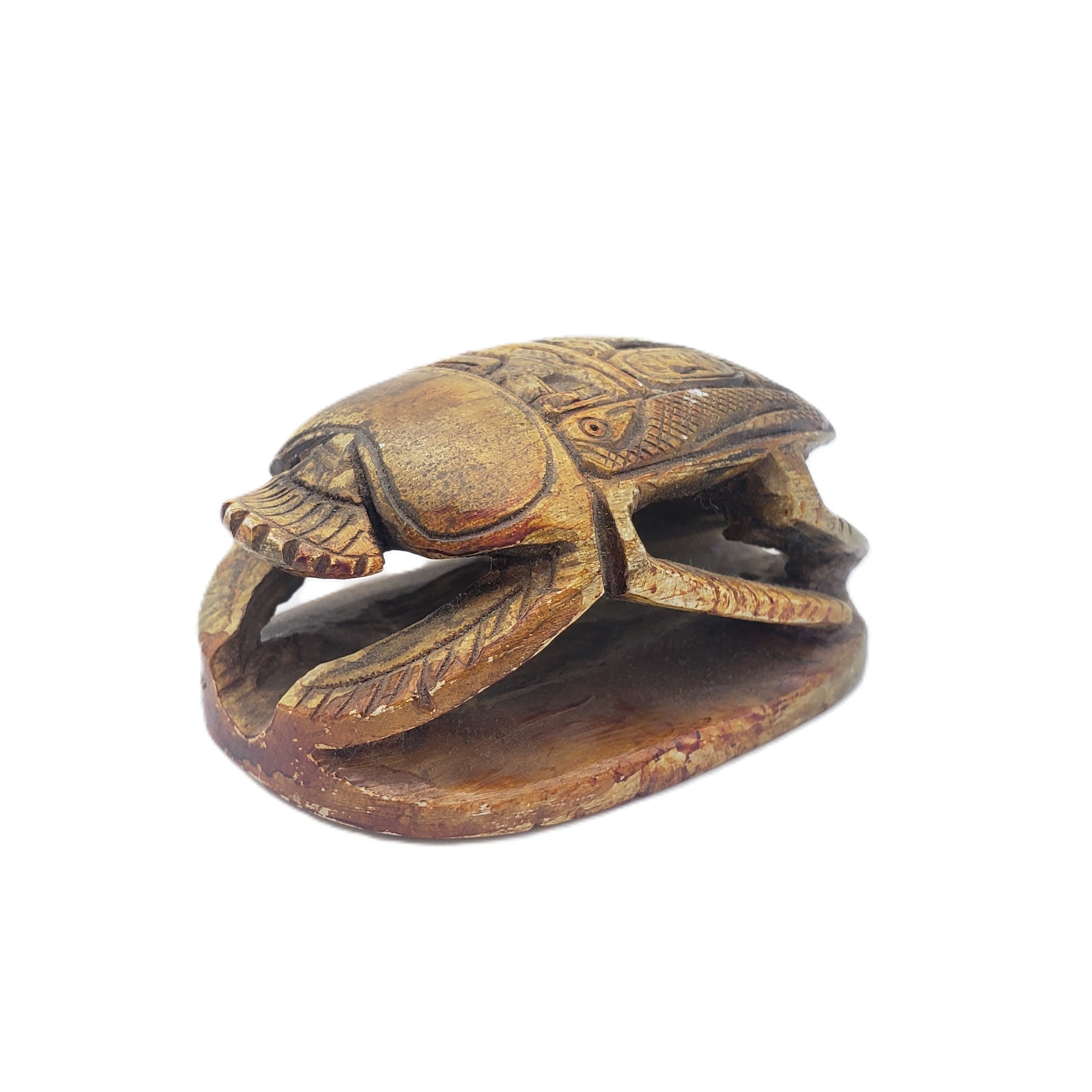 Egyptian scarab figurine on a white background