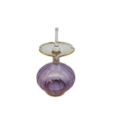 Purple glass perfume bottle with a white background