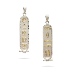 Two gold and silver pendants on a white background