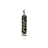 Decorative pendant with black and gold design on a white background