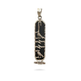 Decorative pendant with black and gold design on a white background