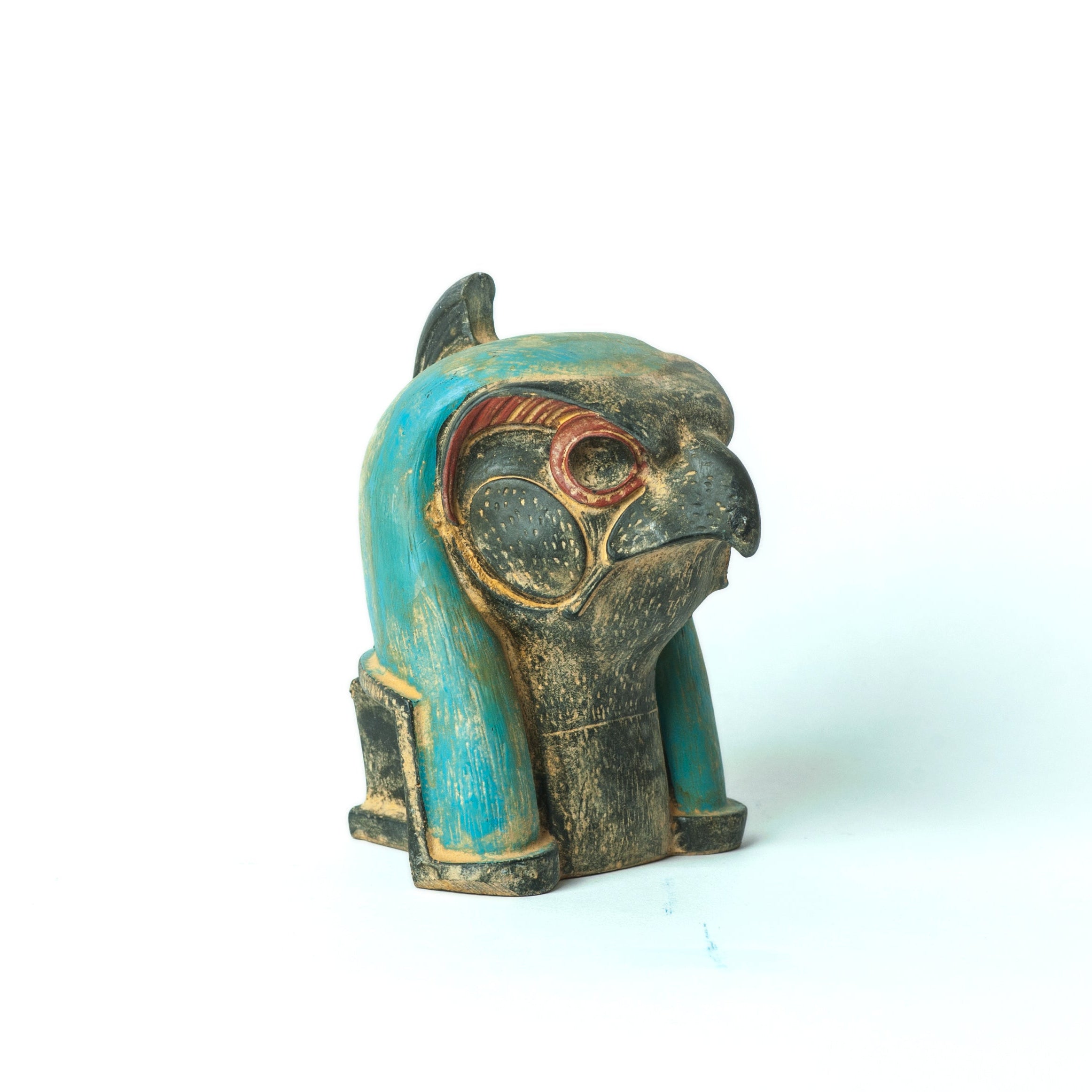 Decorative figurine with turquoise and gold colors on a white background