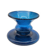 A handblown blue glass candle holder with a bubble shape and a solid base, displayed against a white background.