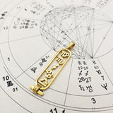 Gold astrological cartouche on a birth chart