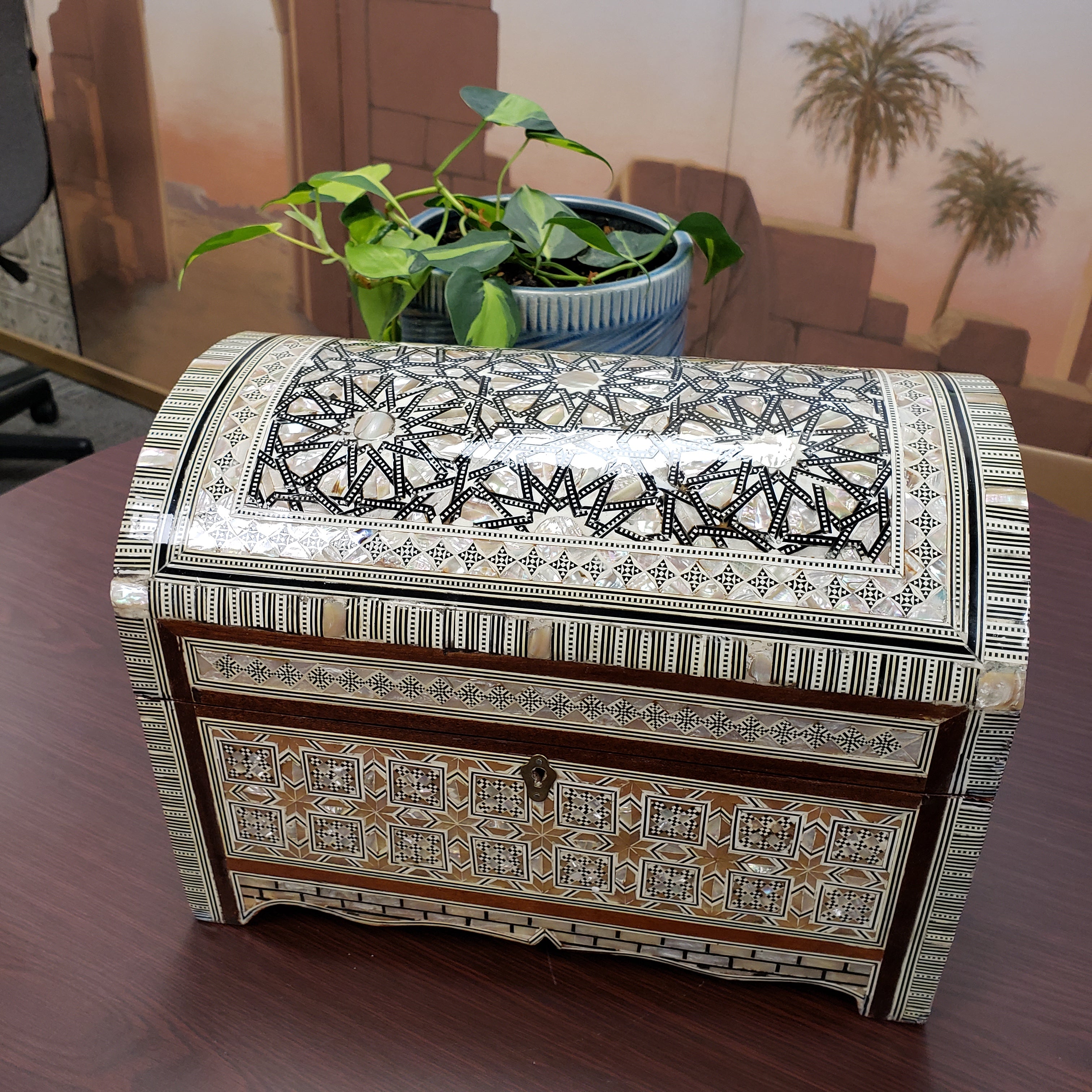 Decorative cabinet with intricate patterns in a room setting