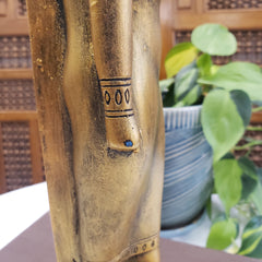 Close-up of a wooden object with text and numbers, blurred background