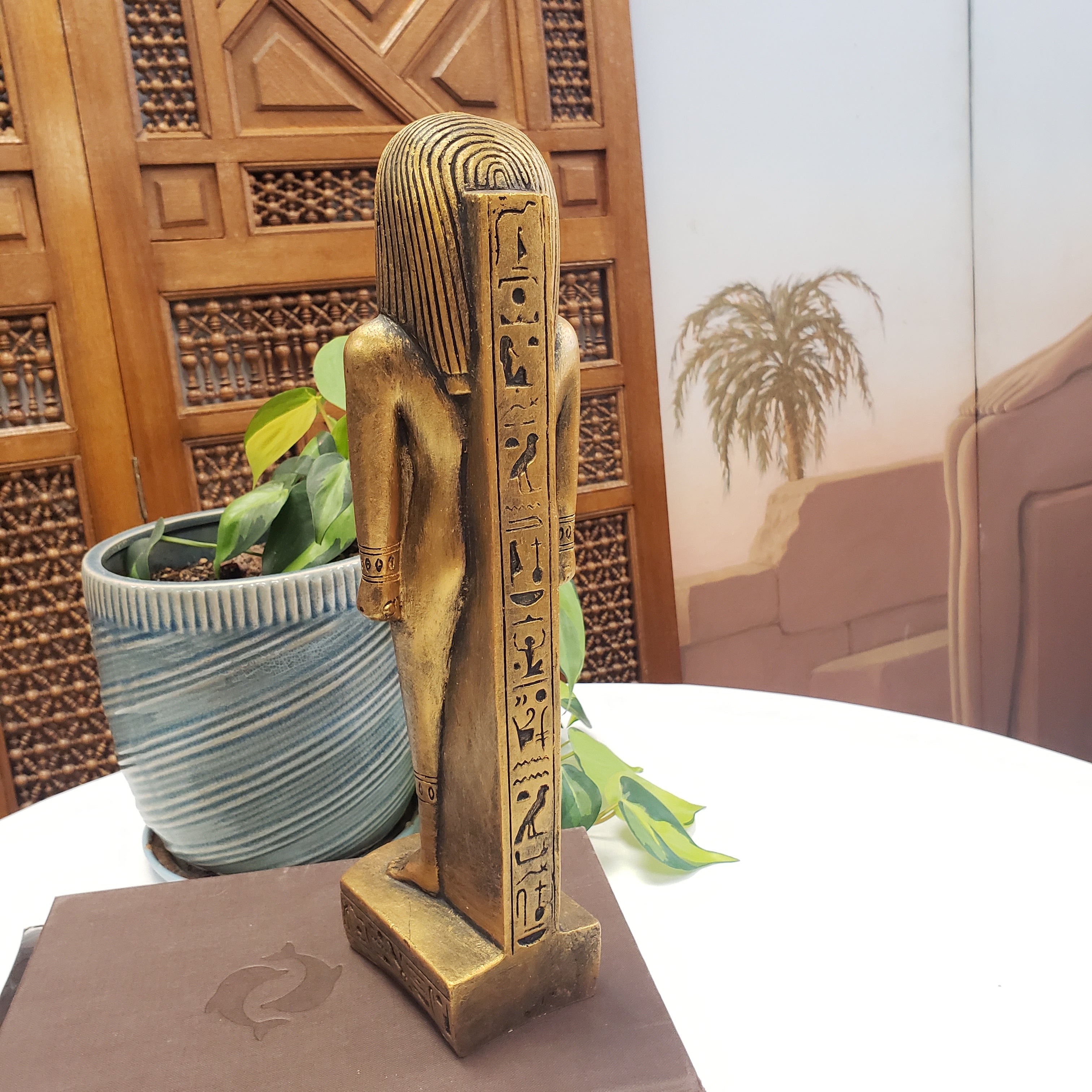 Decorative item with intricate carvings on a wooden surface