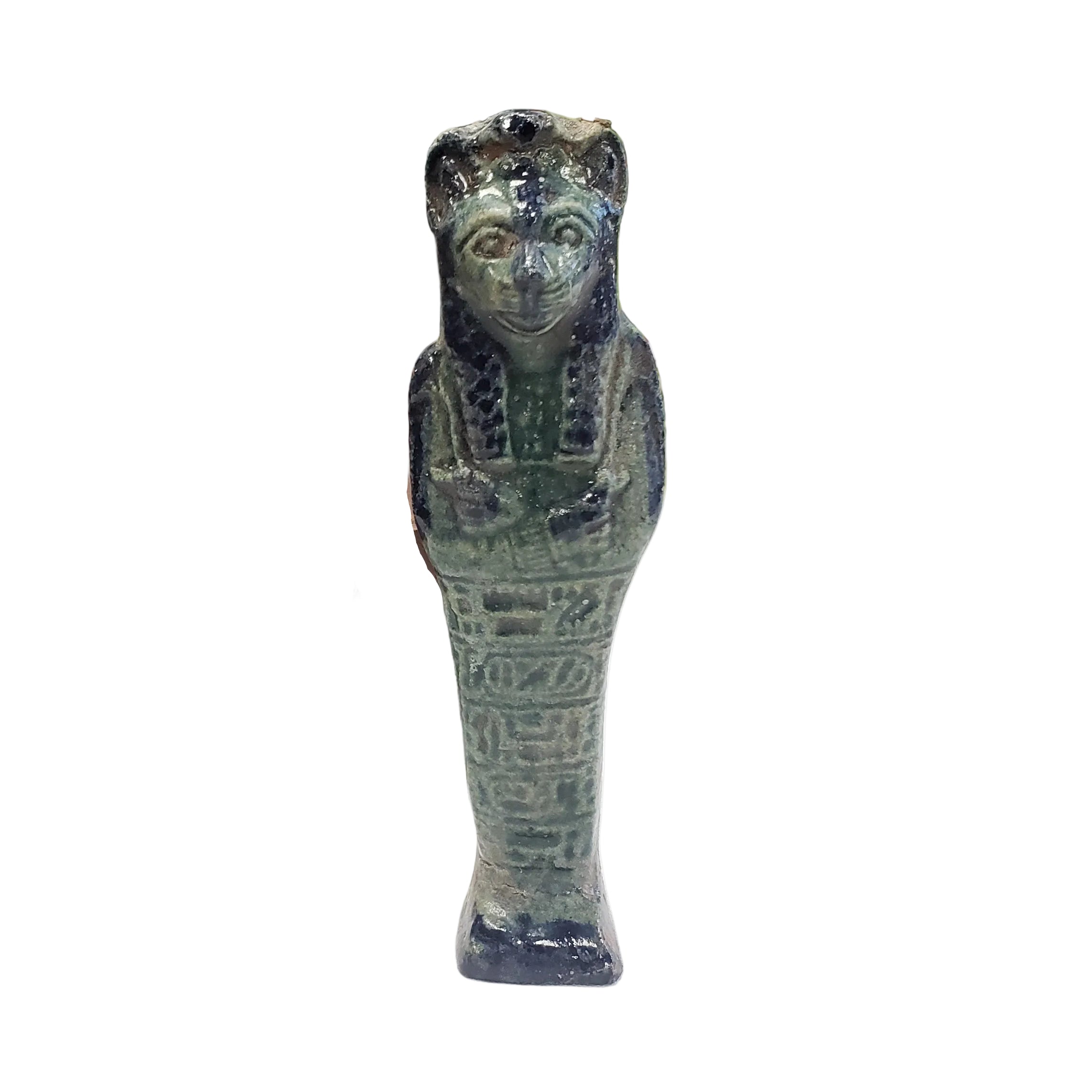 Decorative Egyptian Sehkmet figure on top, leaning against books in a room with plants and wooden paneling.